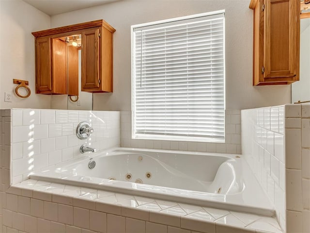 bathroom with a relaxing tiled tub