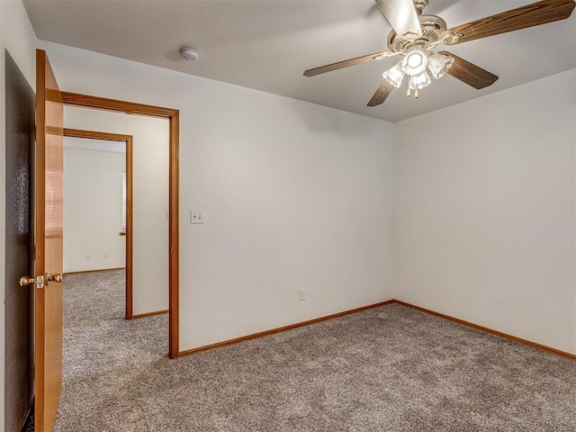 unfurnished room with carpet floors and ceiling fan