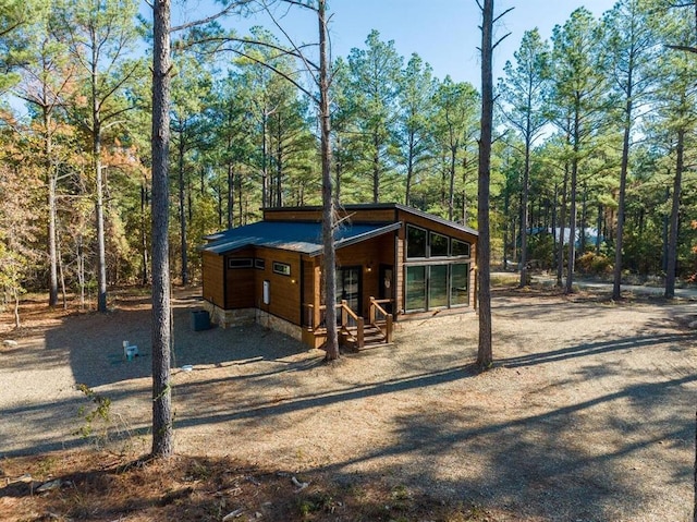 180 Alumacraft Trl, Broken Bow, OK 74728 - view of outdoor structure with a wooded view
