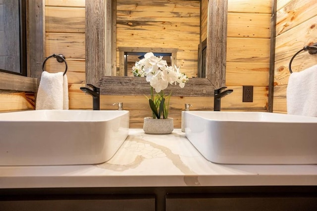 interior space featuring wooden walls and vanity