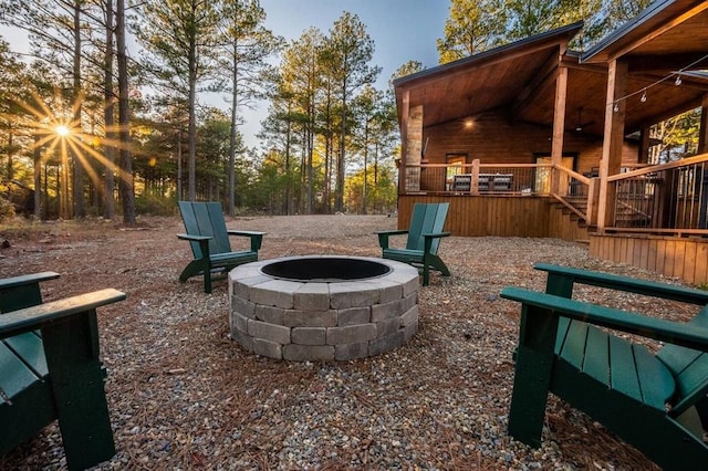 view of yard featuring an outdoor fire pit