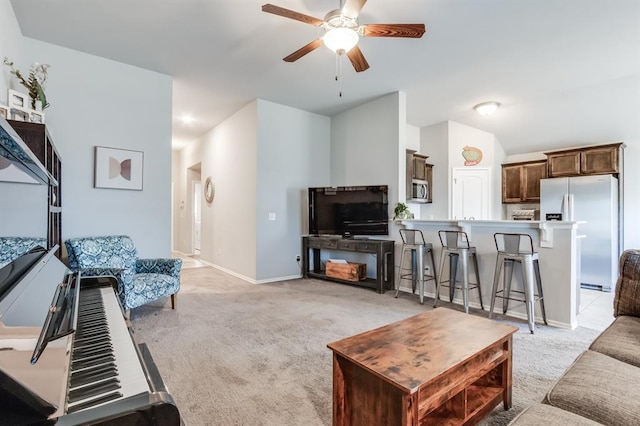 living room with ceiling fan and light carpet