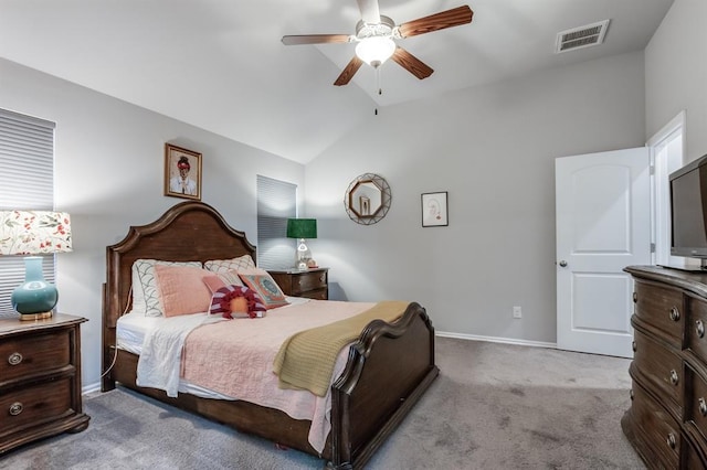 bedroom featuring ceiling fan, light colored carpet, and vaulted ceiling