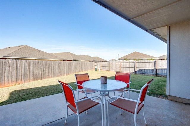 view of patio featuring a fenced backyard and outdoor dining space