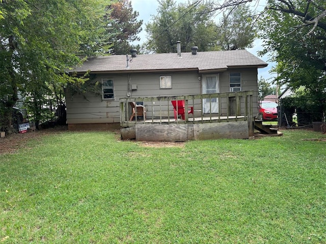 back of house featuring a lawn