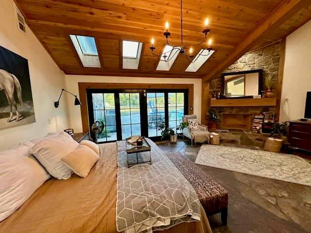 bedroom featuring access to exterior, french doors, an inviting chandelier, vaulted ceiling, and wood ceiling