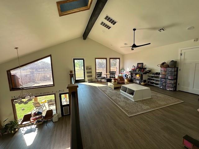 living room featuring beamed ceiling, dark hardwood / wood-style flooring, high vaulted ceiling, and ceiling fan