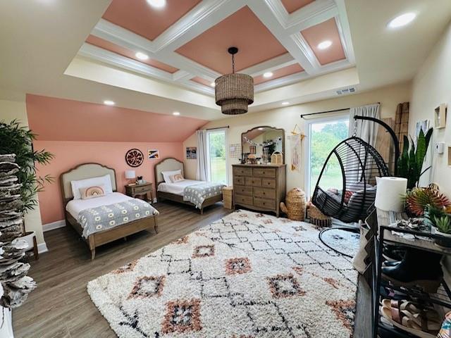 bedroom with hardwood / wood-style flooring, beam ceiling, and coffered ceiling