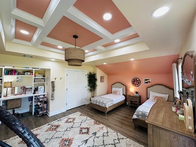 bedroom with beam ceiling, crown molding, dark wood-type flooring, and coffered ceiling