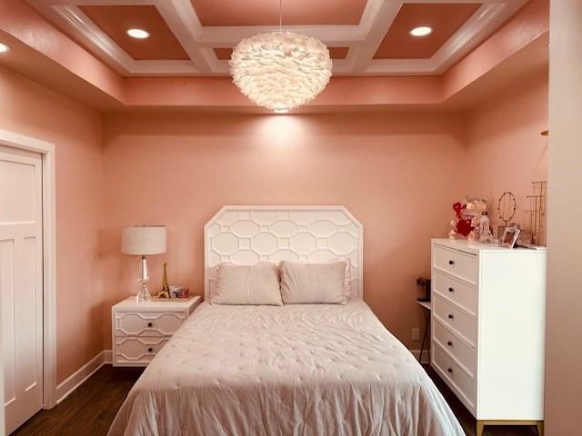 bedroom featuring coffered ceiling and dark hardwood / wood-style floors