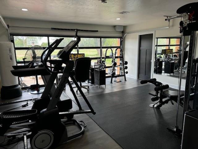 exercise room featuring a textured ceiling