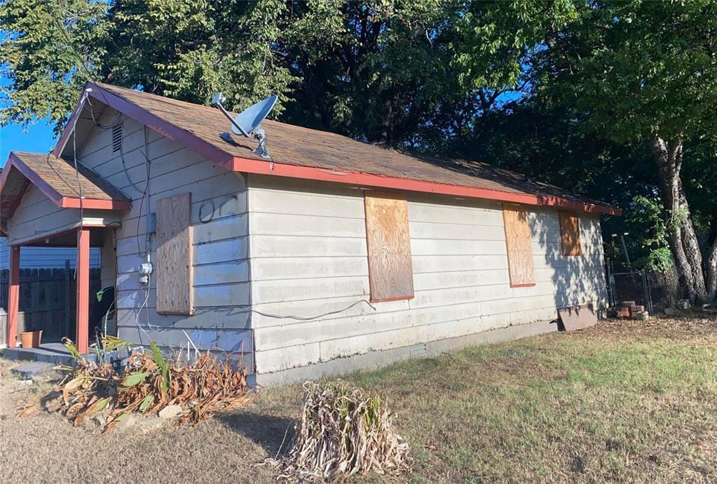 view of property exterior featuring a lawn