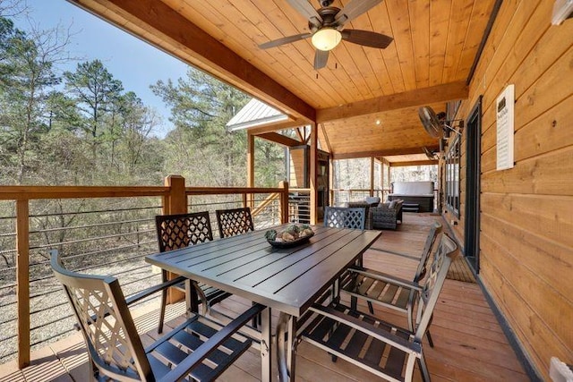 wooden deck featuring ceiling fan