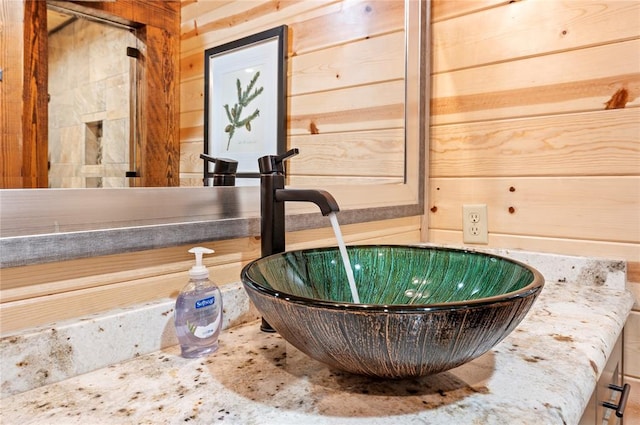 details with a jacuzzi, wooden walls, and a sink