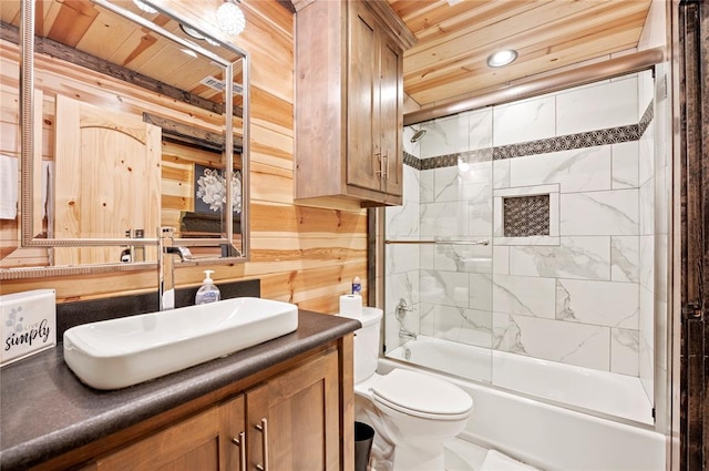 full bath featuring toilet, wooden ceiling, enclosed tub / shower combo, vanity, and wood walls