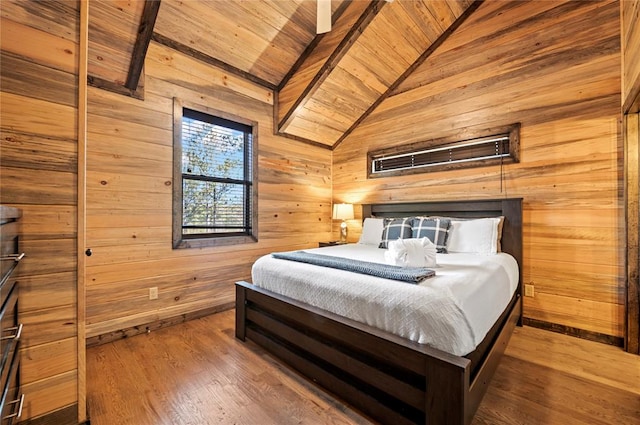 bedroom with wood walls, wood ceiling, vaulted ceiling, and wood finished floors