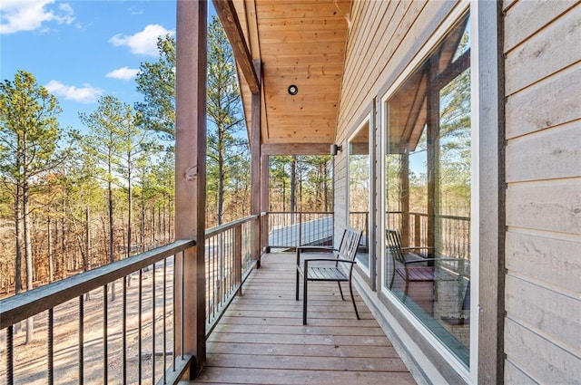 unfurnished sunroom featuring wood ceiling