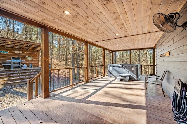 unfurnished sunroom featuring wood ceiling and a healthy amount of sunlight