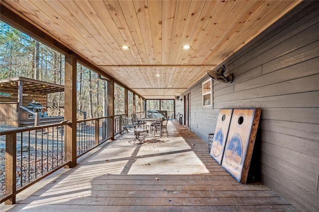 unfurnished sunroom featuring wooden ceiling