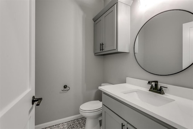 bathroom with tile patterned floors, vanity, and toilet