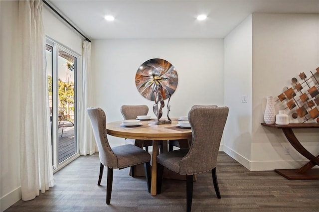 dining room with dark hardwood / wood-style flooring