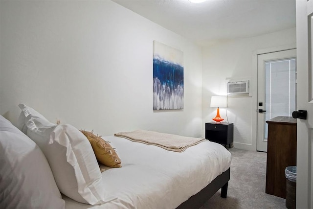 carpeted bedroom with a wall mounted AC