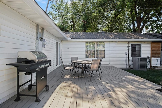 wooden terrace featuring grilling area and central air condition unit