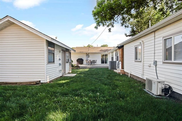 view of yard featuring central AC and ac unit