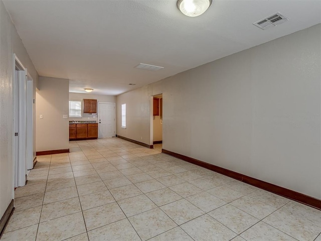 spare room with light tile patterned floors