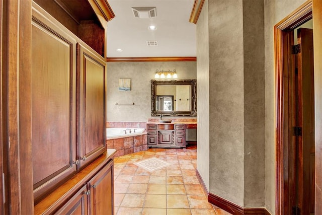 bathroom with vanity, a relaxing tiled tub, and ornamental molding