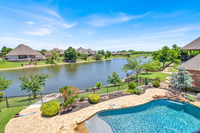 view of pool with a water view and a patio area