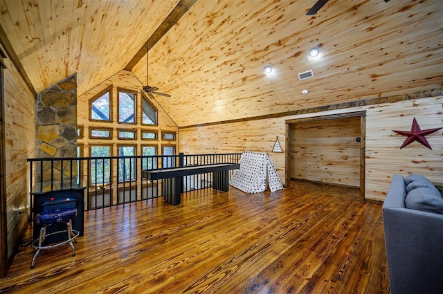 additional living space with hardwood / wood-style flooring, ceiling fan, wooden ceiling, and beamed ceiling