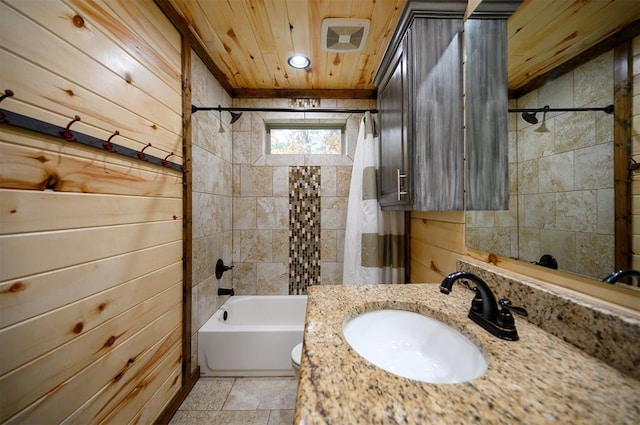 bathroom featuring shower / bath combo, vanity, wood walls, and wood ceiling