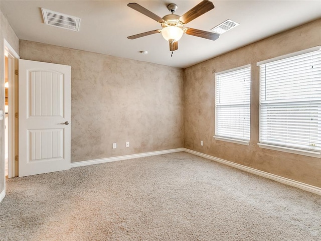 carpeted empty room with ceiling fan