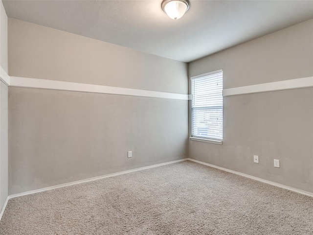 unfurnished room featuring carpet flooring