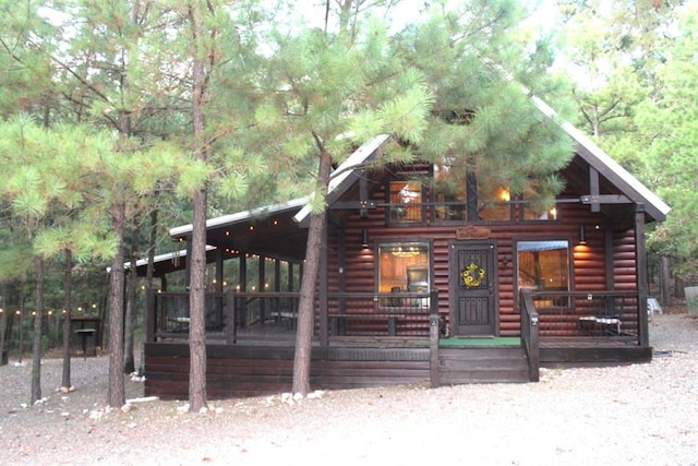 log home with covered porch