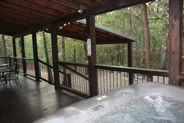 deck featuring a hot tub