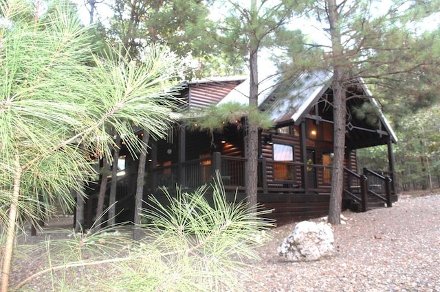 view of property exterior with covered porch