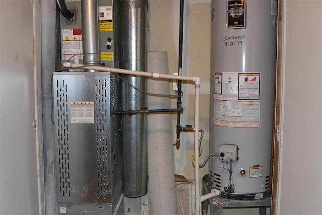 utilities featuring heating unit and gas water heater