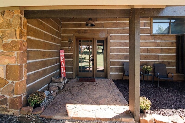 property entrance featuring french doors