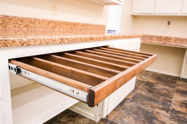 details featuring white cabinetry