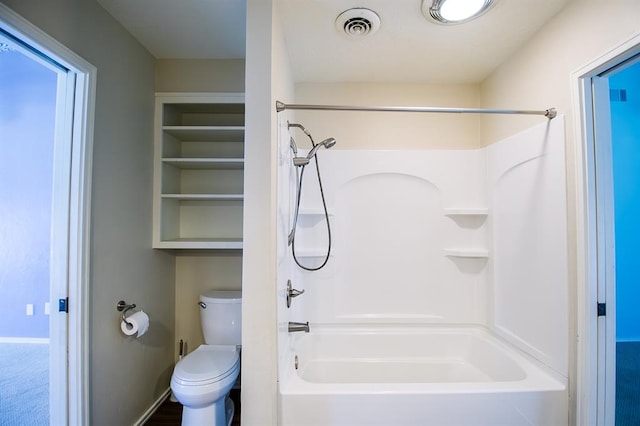 bathroom featuring shower / bath combination and toilet