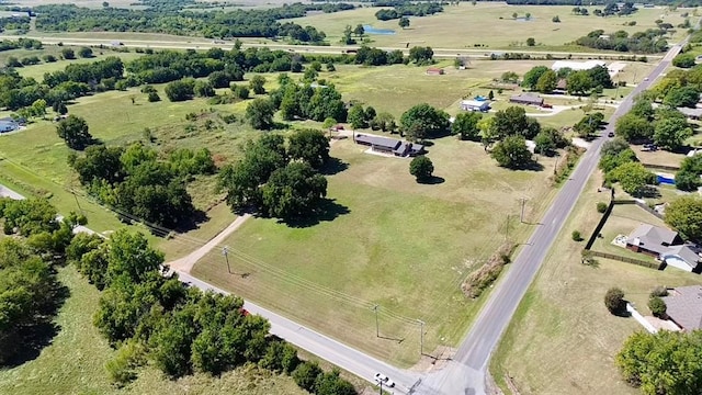 birds eye view of property featuring a rural view