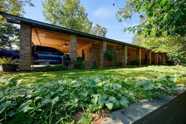 view of side of property with a lawn