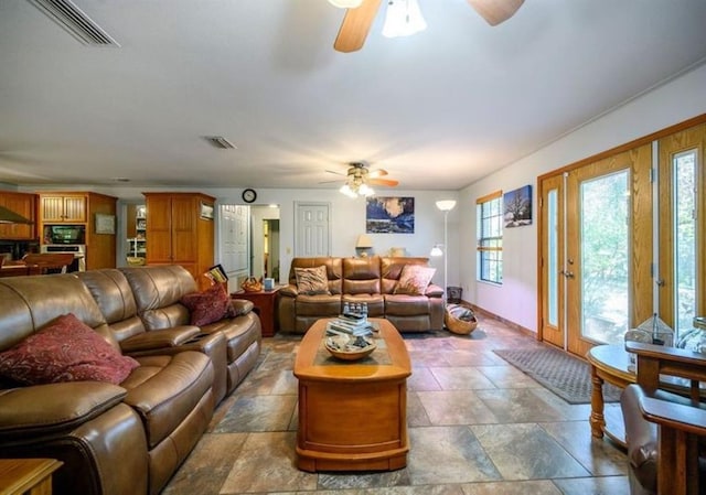 living room featuring ceiling fan