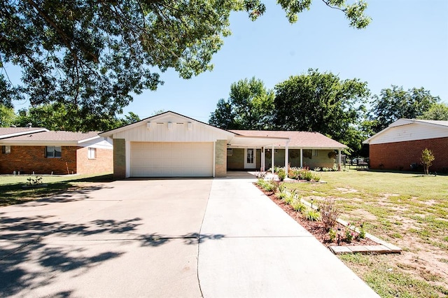 ranch-style house with a garage and a front yard