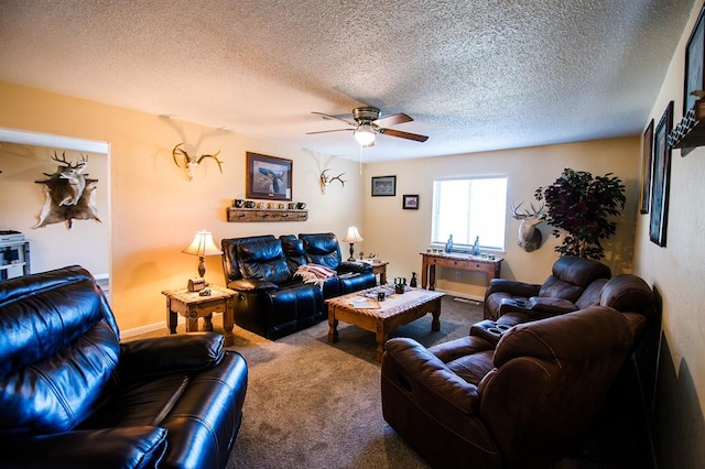 carpeted living room featuring ceiling fan and a textured ceiling