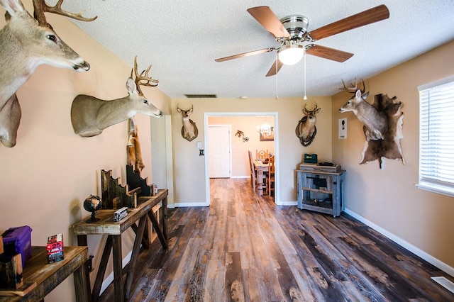 interior space with dark hardwood / wood-style flooring and a textured ceiling