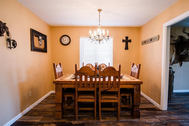 dining area featuring a notable chandelier, dark hardwood / wood-style flooring, and a textured ceiling