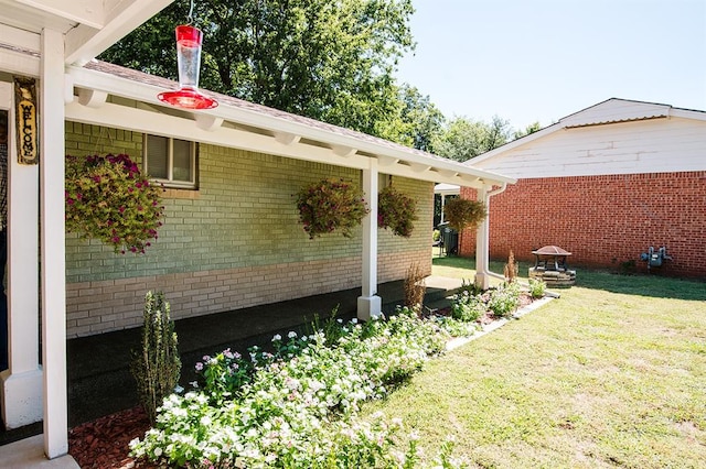 view of side of property with a lawn